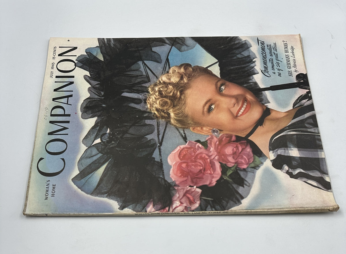 Alternate view of the Woman’s Home Companion Magazine July 1945 cover, highlighting Shirley Johns adorned with roses and an elegant black umbrella.