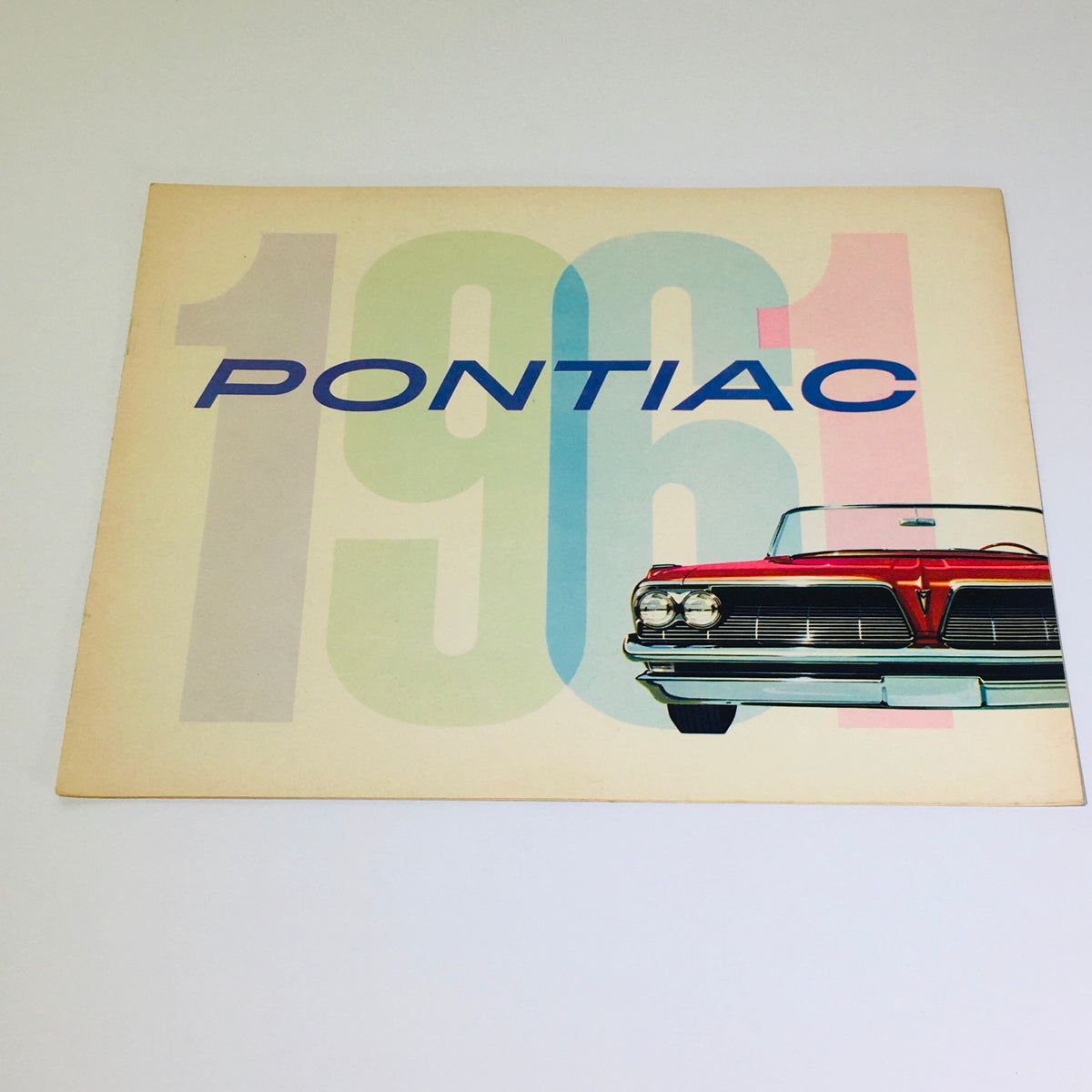 Vintage 1961 Pontiac Catalina Sports Coupe brochure cover featuring the iconic car design and bold '1961' typography.