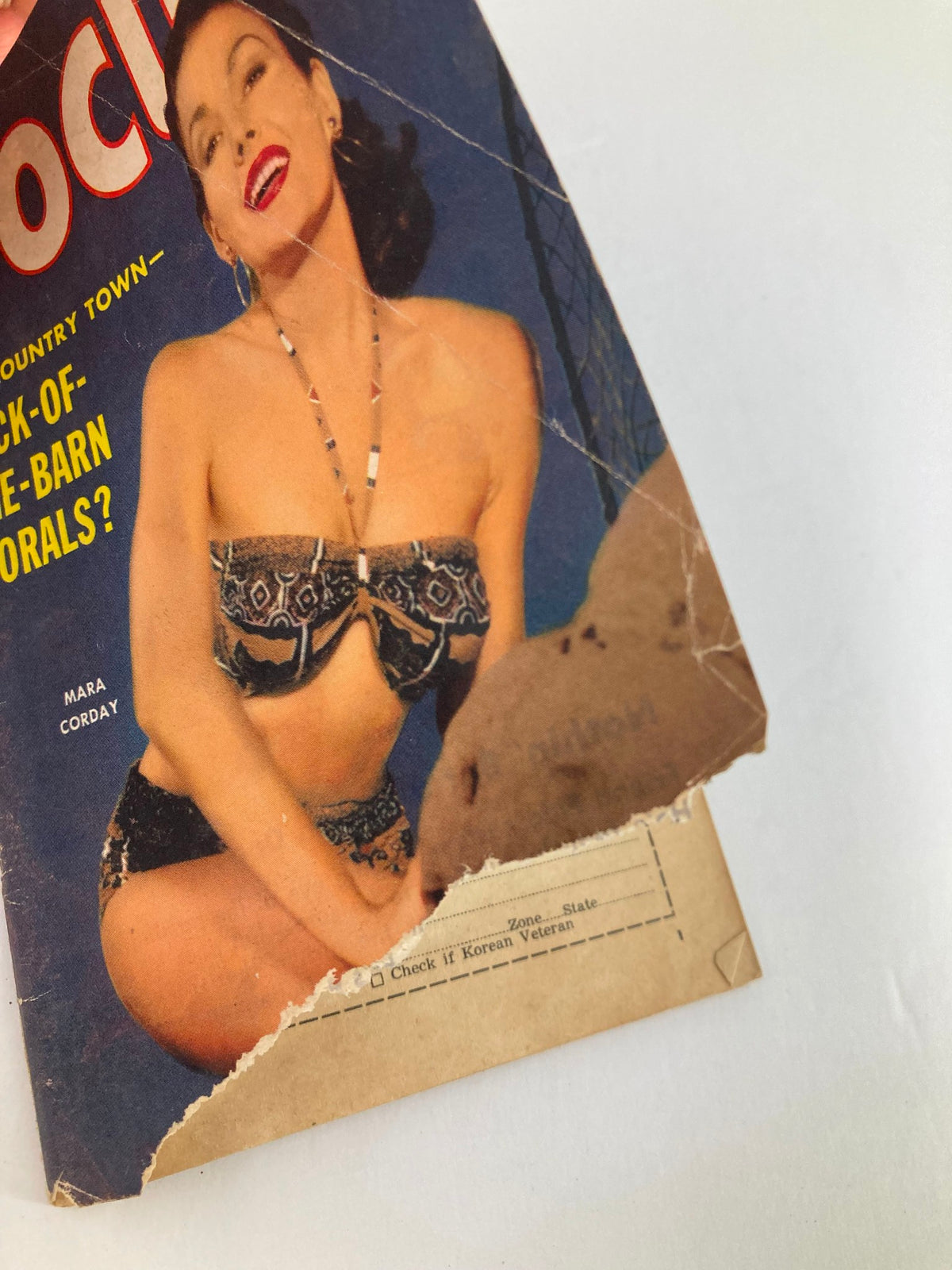 Close-up view of the cover of VTG Focus Magazine February 1957 Vol 7 #2 with Mara Corday, highlighting the vintage wear and charm of the magazine.