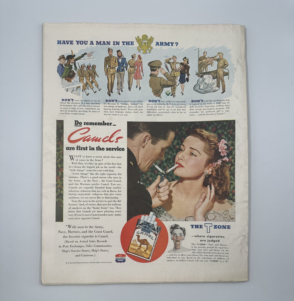 Back cover of Woman’s Home Companion Magazine April 1943 with a colorful advertisement featuring a couple and promotional content about Camel cigarettes, set against a romantic background.