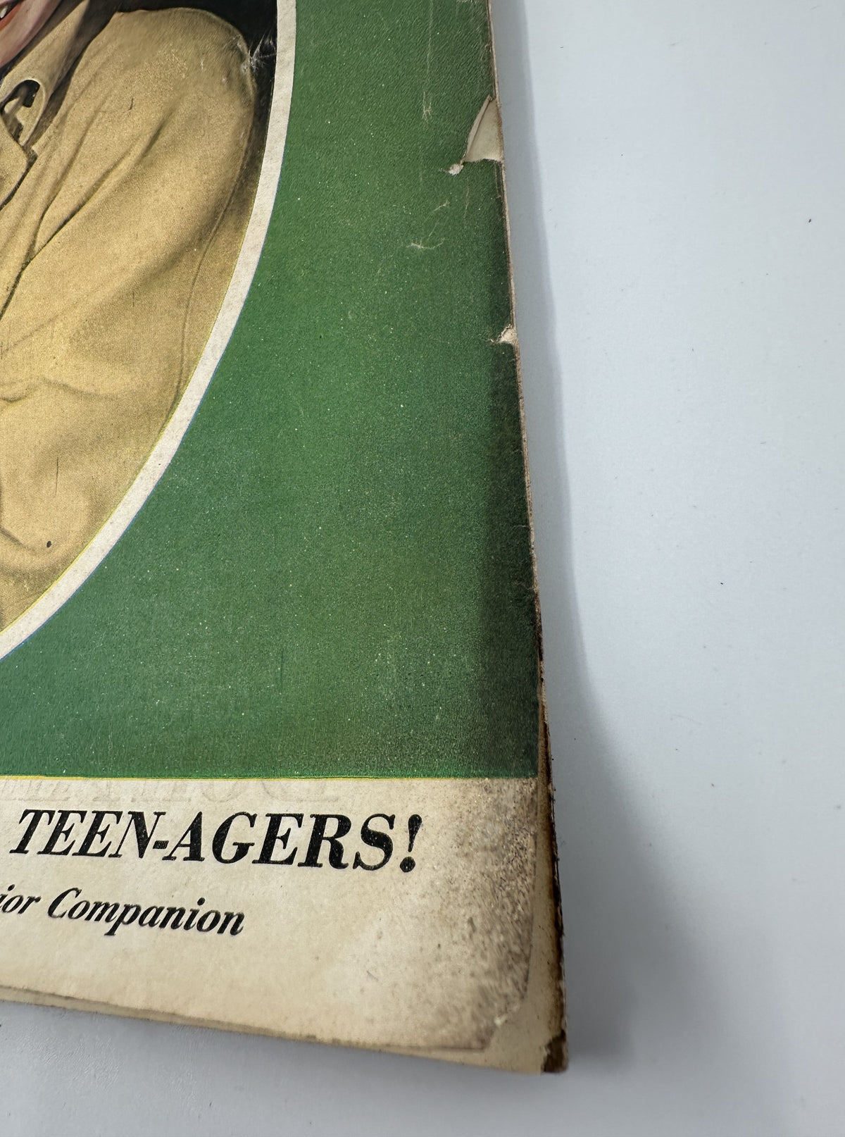 Close-up view of the cover of Woman's Home Companion Magazine, October 1945, highlighting wear and tear on the edges, featuring the title 'Once in Every Lifetime Teen-Agers'.