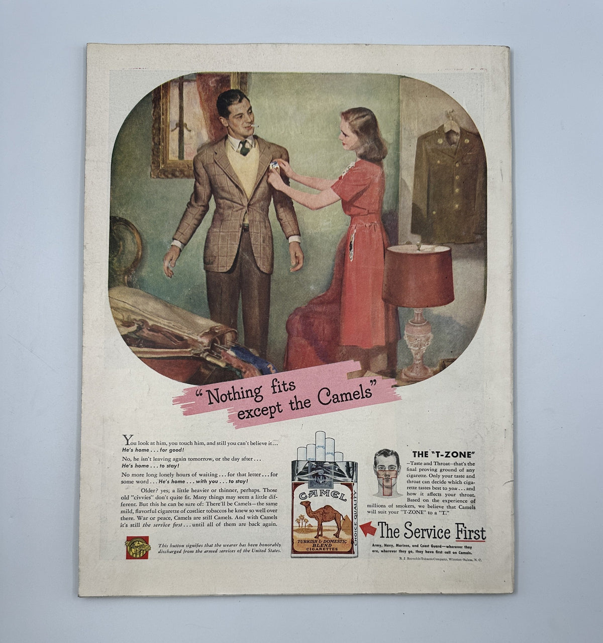 Back cover of Woman’s Home Companion Magazine December 1945, featuring an advertisement that reads 'Nothing fits except the Camels' with a couple in a vintage setting.