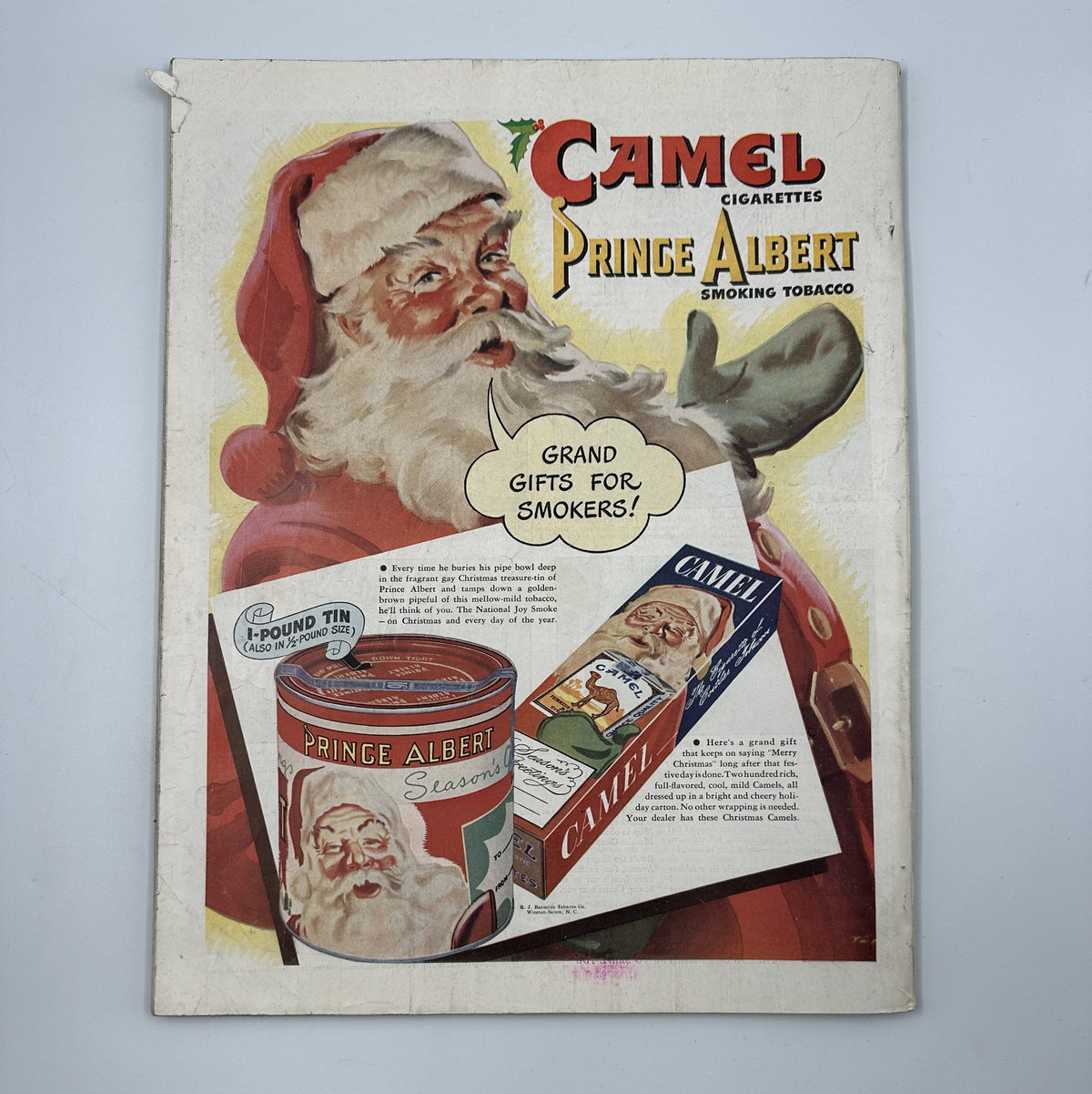 Cover of Woman’s Home Companion Magazine December 1946 featuring a colorful Christmas theme with Santa Claus promoting Camel cigarettes and Prince Albert smoking tobacco as a festive gift idea.