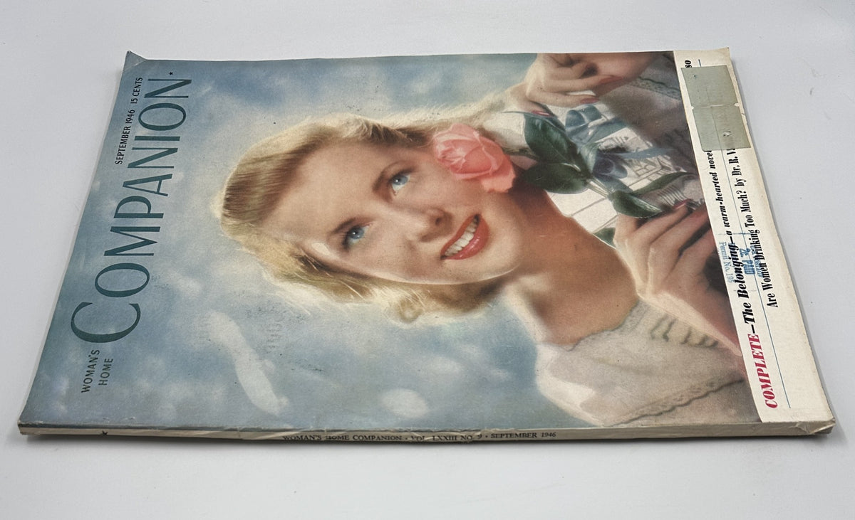 Another angle of the cover of Woman’s Home Companion Magazine September 1946 with a woman holding a rose, highlighting its classic Mid-Century Modern design.