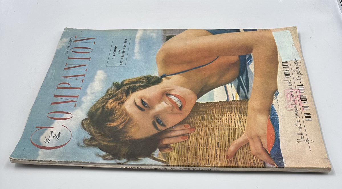 Another angle of the Woman’s Home Companion Magazine July 1950 cover with a young woman in a swimsuit by a wicker basket, highlighting A. J. Cronin's 'Why I Believe in God' article.