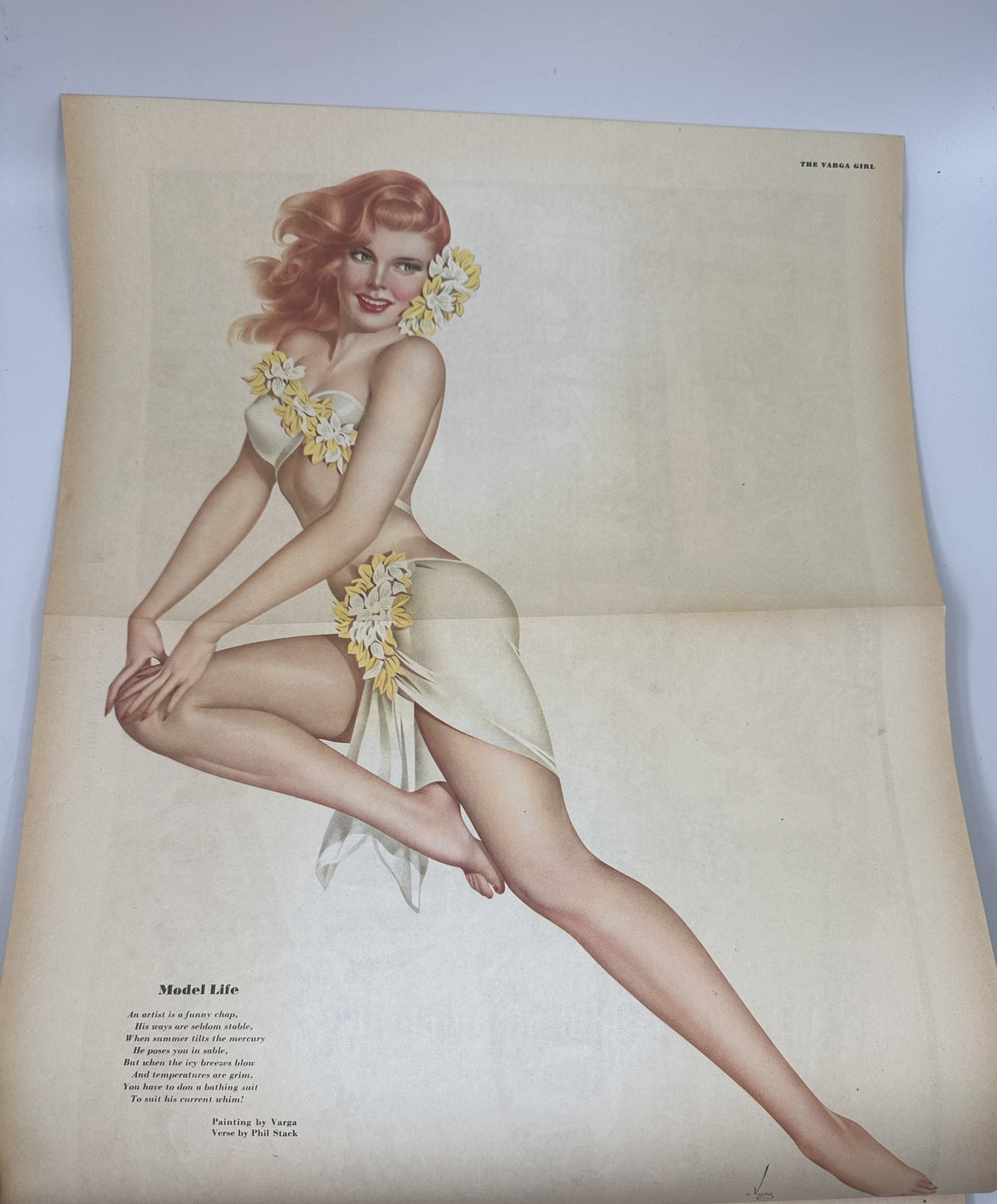 Vintage pinup art titled 'Model Life' from Esquire Magazine November 1945 featuring a model adorned with flowers in a playful pose.