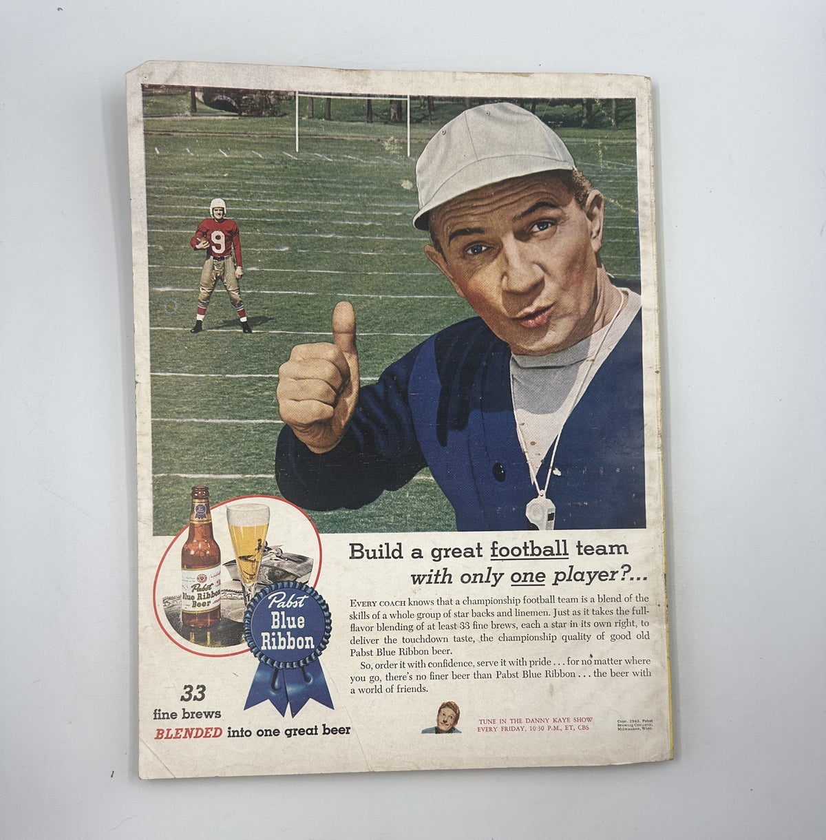 Esquire Magazine November 1945 ad promoting Pabst Blue Ribbon beer with a football coach encouraging teamwork and celebration.