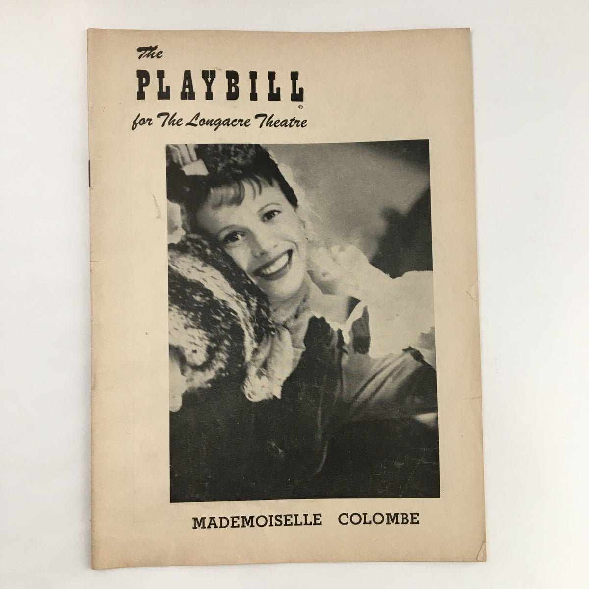 1954 Playbill featuring Julie Harris in Mademoiselle Colombe, showcasing a smiling actress on the front cover.