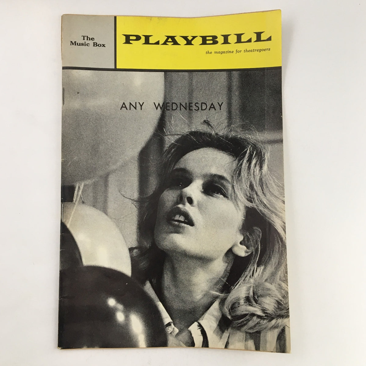 1964 Playbill for 'Any Wednesday' featuring Sandy Dennis, showcasing a black and white image of the actress with balloons from The Music Box Theatre.