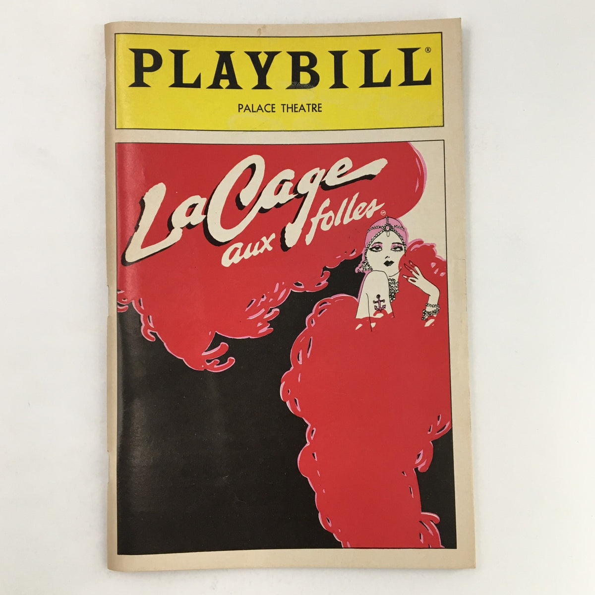 1983 Playbill for La Cage Aux Folles at The Palace Theatre featuring vibrant artwork and George Hearn.