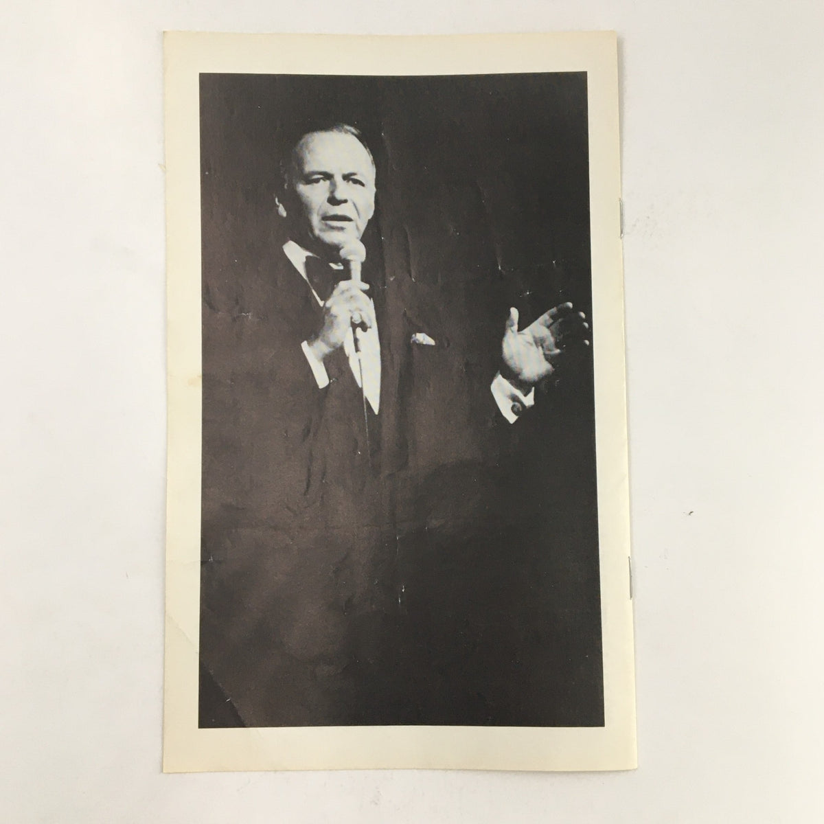 Another black and white image from the 1978 Playbill Radio City Music Hall Present Intermission of Frank Sinatra, showing Sinatra gesturing passionately while holding a microphone, capturing his artistic presence.