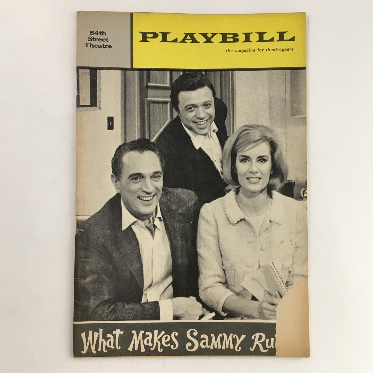 1965 Playbill for the Broadway production What Makes Sammy Run? at the Fifty-Fourth Street Theatre, featuring black and white images of the cast, encapsulating the charm and nostalgia of 1960s theater.