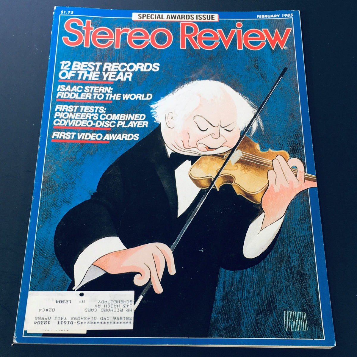 Cover of VTG Stereo Review Magazine February 1985 featuring Isaac Stern, titled 'Fiddler To The World', highlighting classical music influences and awards of the year, with artistic illustration of Stern playing the violin.