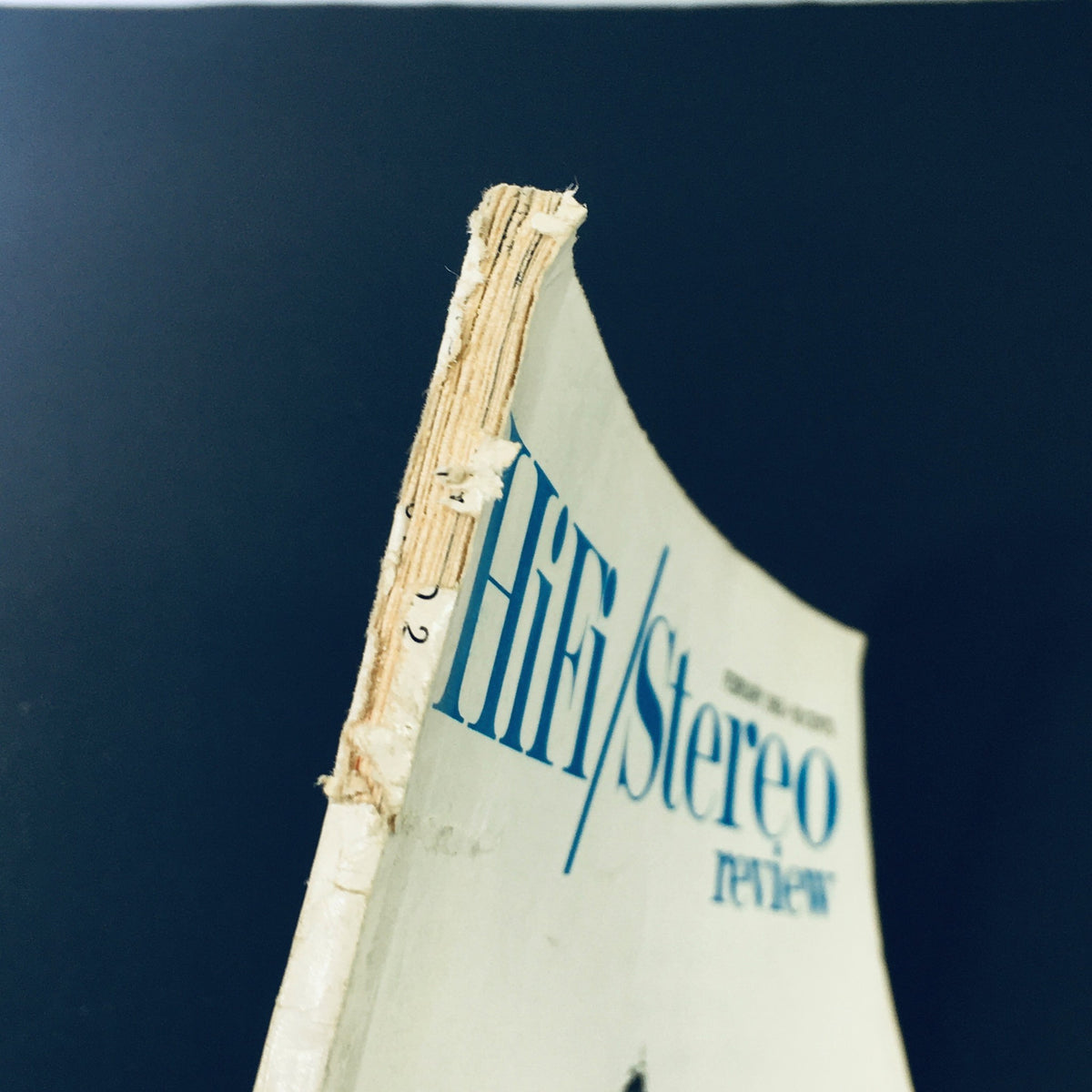 Spine of the VTG HiFi Stereo Review Magazine February 1963, highlighting the vintage wear and tear characteristic of used publications, adding to its collectible charm.