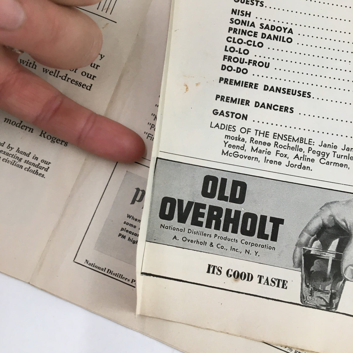 1943 Playbill for The Merry Widow, showcasing an advertisement and cast list, including Old Overholt whiskey brand.