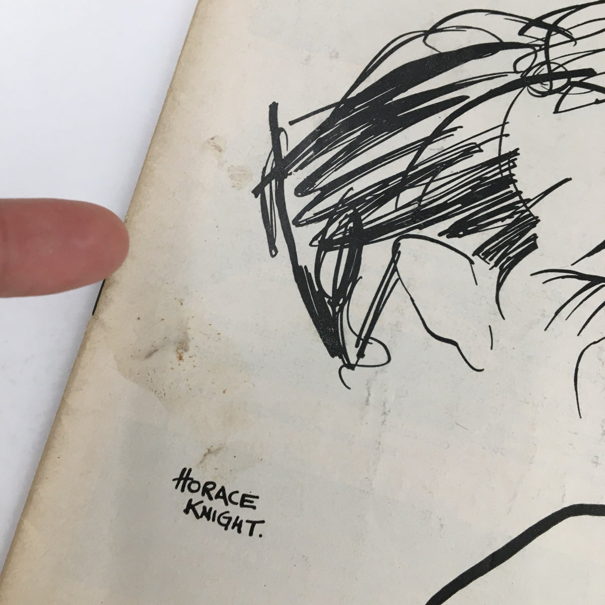 Close-up of the 1957 Playbill for The Tunnel of Love, showcasing Horace Knight's sketch and highlighting details of the condition.