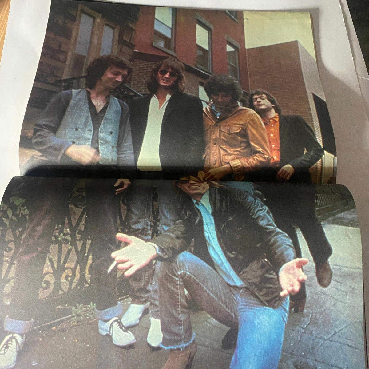Centerfold image from the May 1980 Hit Parader magazine featuring a group of musicians posing outdoors, exemplifying the fashion and style of the late 1970s rock scene.