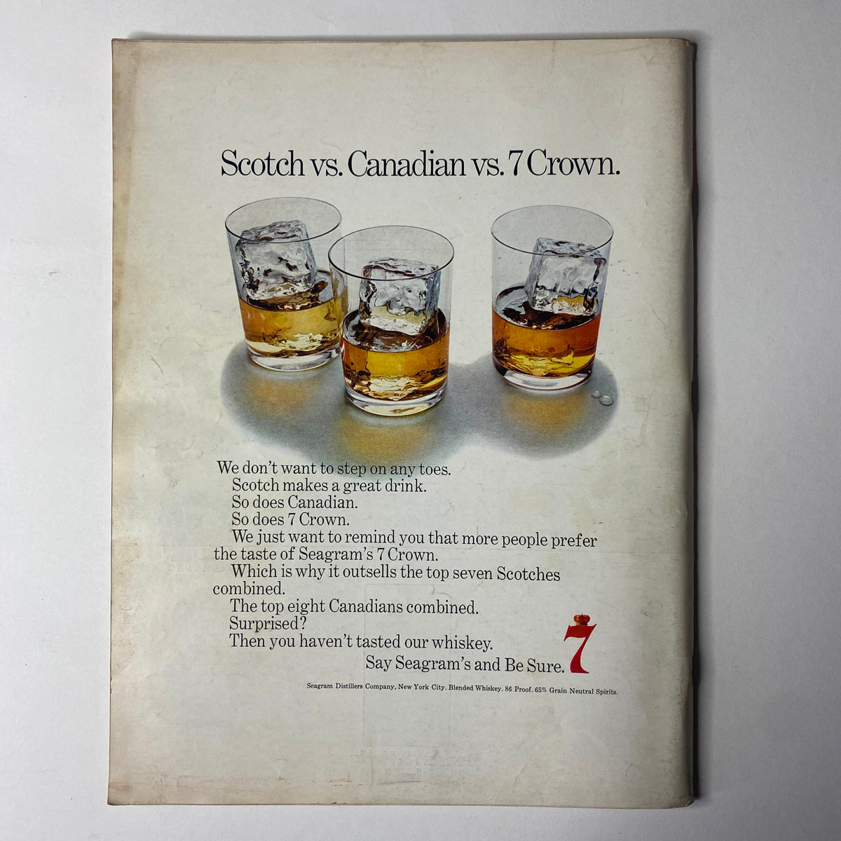 Advertisement for Seagram’s whiskey in Ebony Magazine March 1969, contrasting Scotch, Canadian whiskey, and 7 Crown with a visual of three glasses.