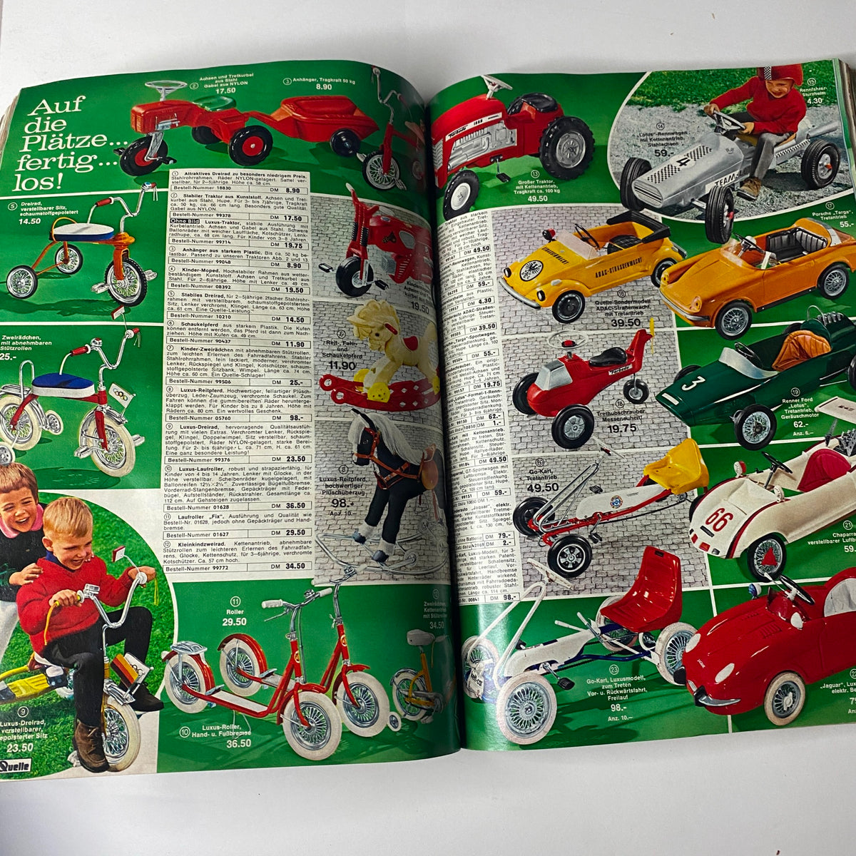 1969 - 1970 Quelle Winter Catalog displaying a range of children's ride-on toys, including tricycles, go-karts, and pedal cars, with pricing information and vibrant backgrounds.