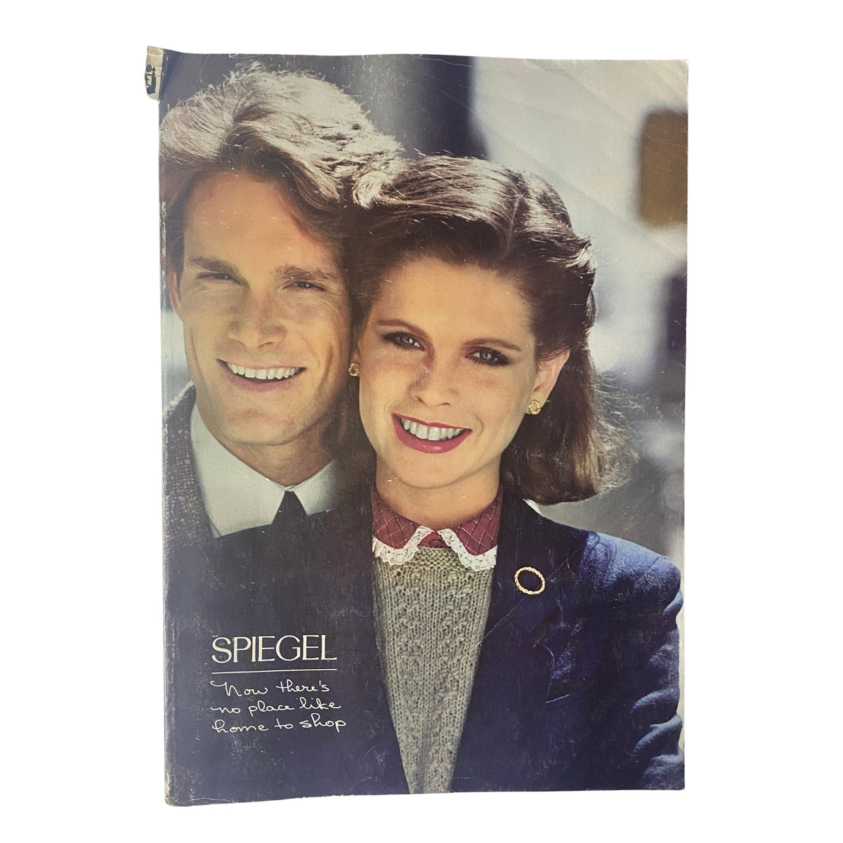 Cover of 1980 Spiegel Fall and Winter Catalog featuring a smiling couple, representing vintage fashion from the 1980s.