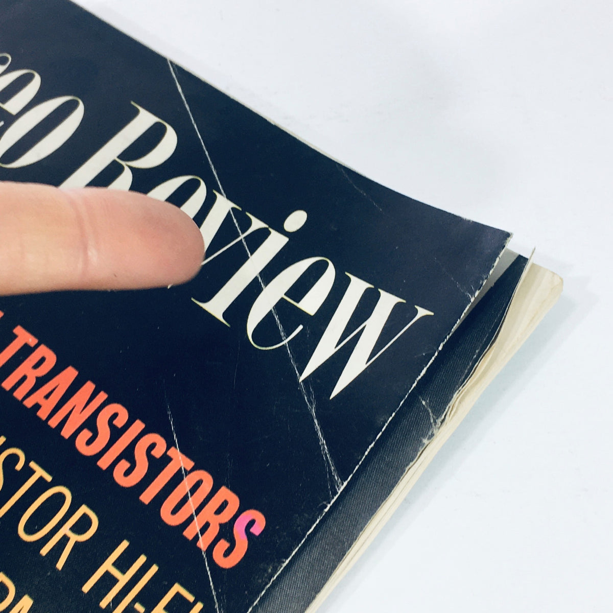 Detail of the cover from VTG HiFi Stereo Review Magazine May 1964, highlighting the title and features related to transistors, demonstrating its vintage condition.