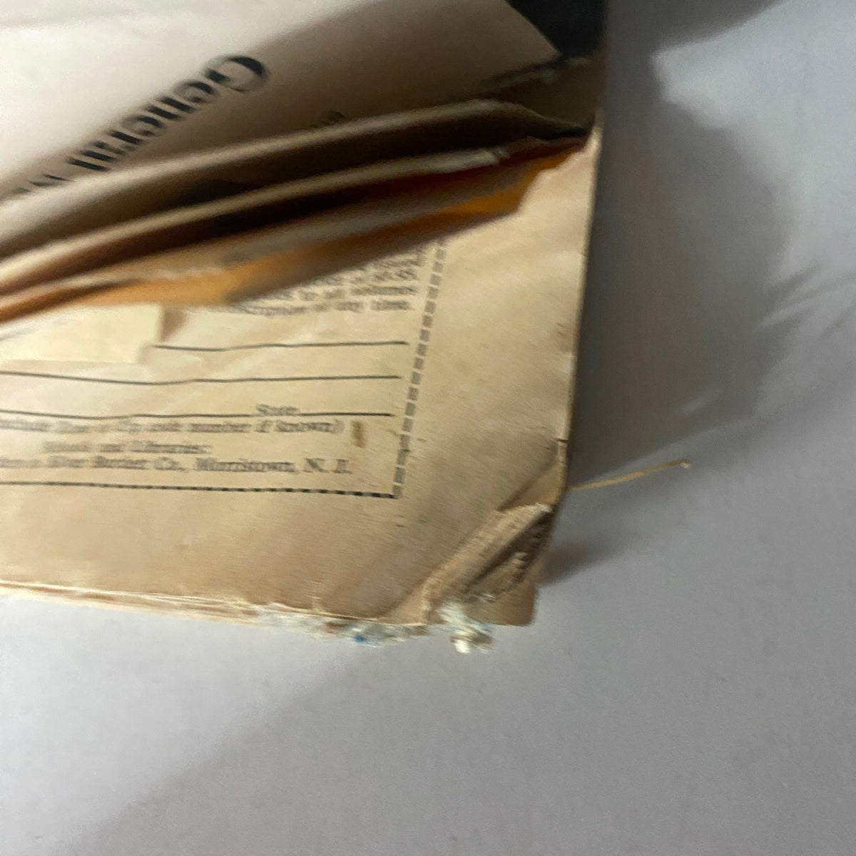 Close-up view of the damaged corner of a vintage magazine titled 'VTG The Reporter Magazine February 23 1967', showcasing wear typical for its age but retaining historical significance.