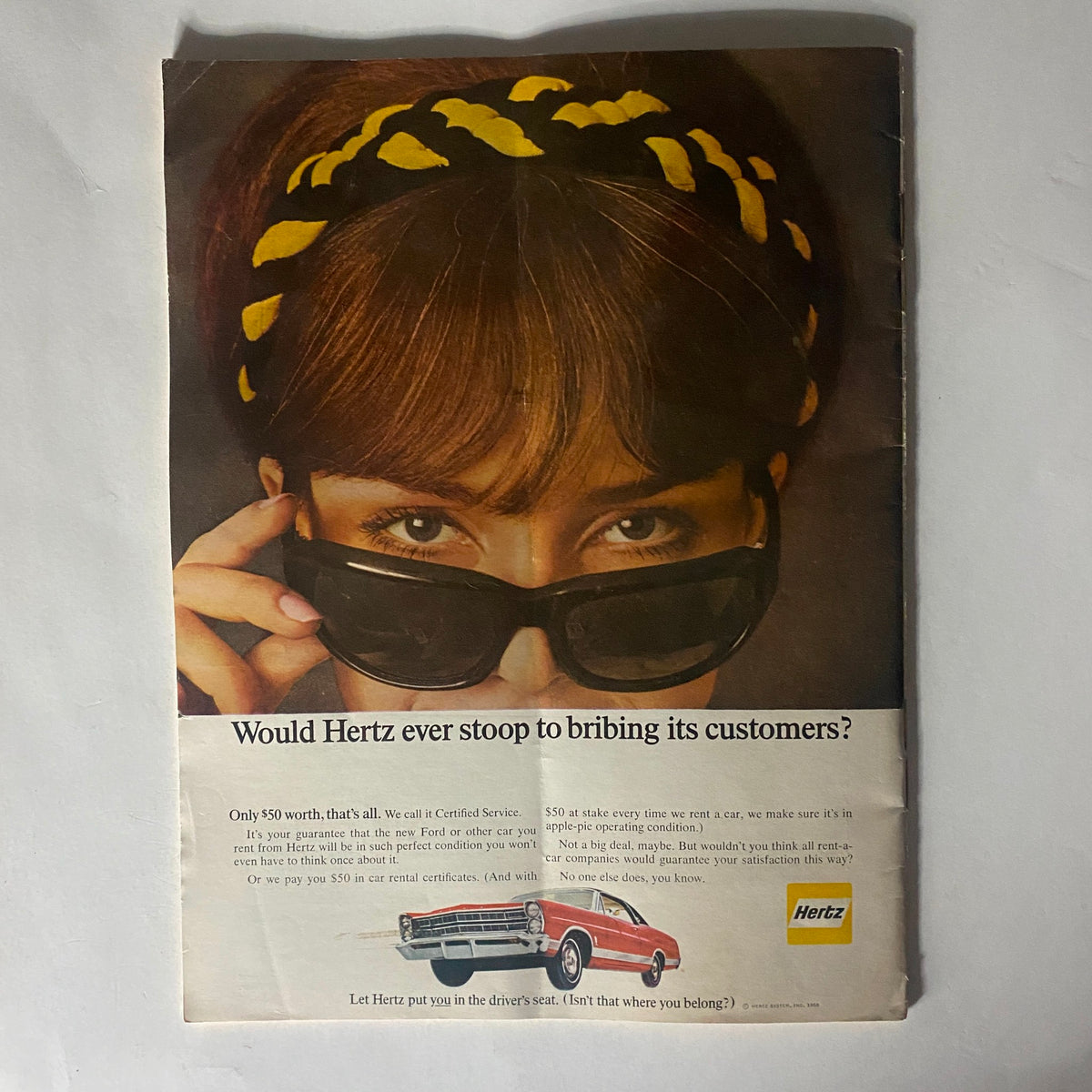 Vintage advertisement from VTG The Reporter Magazine October 6 1966 featuring a woman wearing sunglasses and a headband promoting Hertz car rentals.