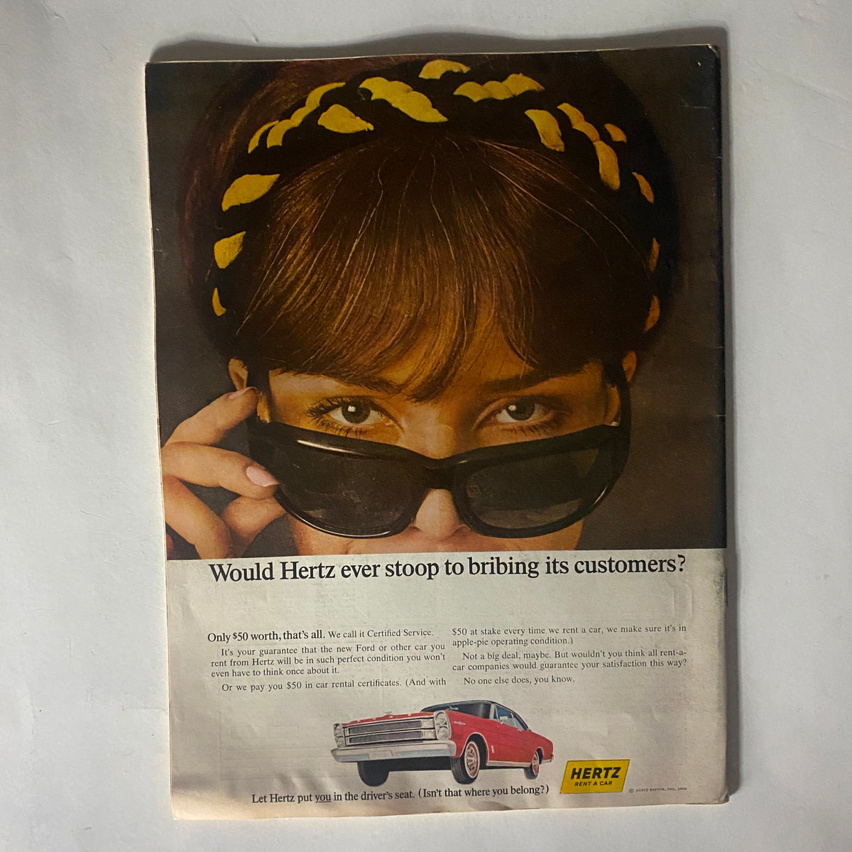 Advertisement from The Reporter Magazine July 14 1966 featuring a woman wearing sunglasses, promoting Hertz rental cars with a classic car in the foreground.