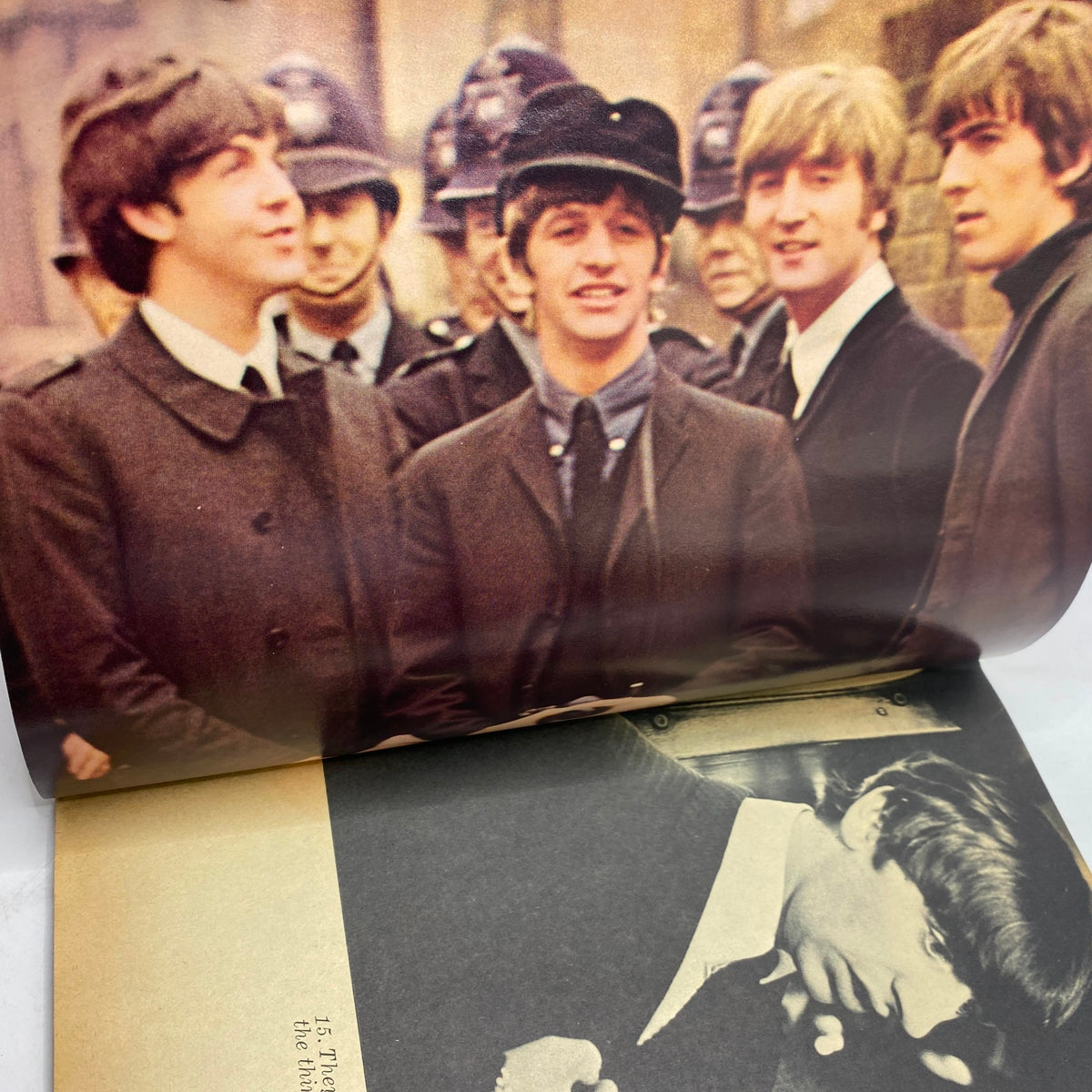 Vintage 1964 Beatles Movie Book featuring iconic scene from 'A Hard Day's Night' with The Beatles standing in front of fans and police.