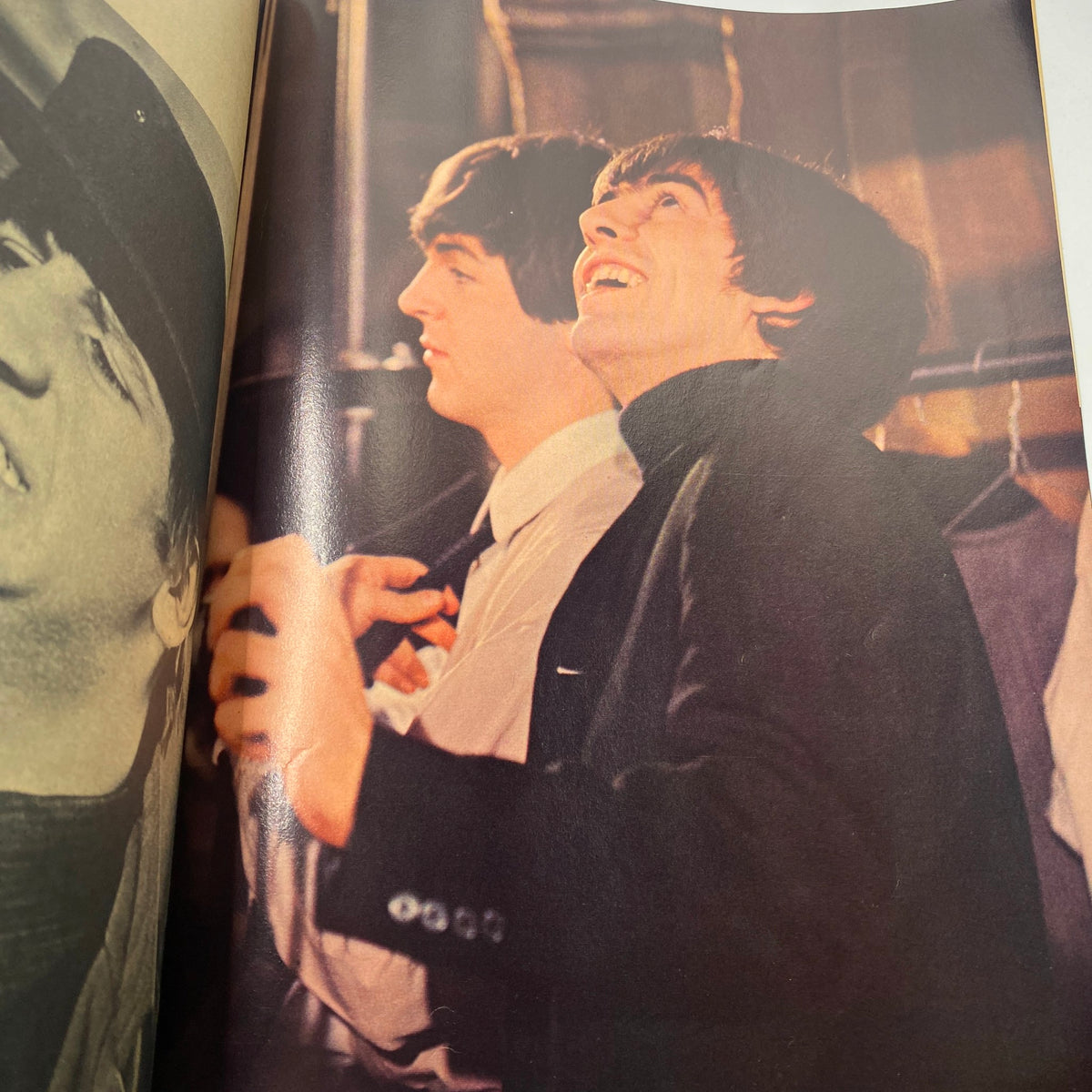 Vintage 1964 Beatles Movie Book depicting The Beatles in a candid moment backstage while preparing for a performance from 'A Hard Day's Night'.