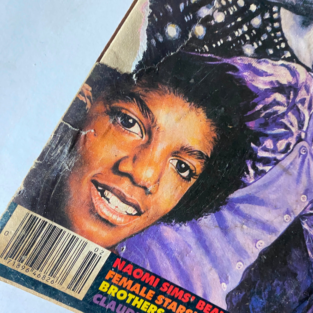 Close-up of the cover art from the VTG Right On Magazine February 1983 featuring a young Michael Jackson. The magazine showcases vibrant colors and details, highlighting the iconic artist during his rise to fame. This vintage item captures a significant cultural moment in music history.
