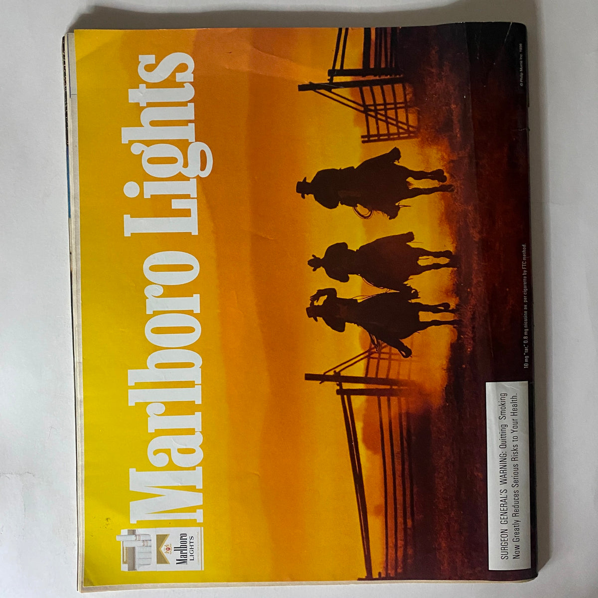 Spin Magazine May 1996 Vol 12 No 2 back cover with a vintage Marlboro Lights ad, featuring cowboys silhouetted against a sunset, capturing the essence of Americana in magazine advertising.