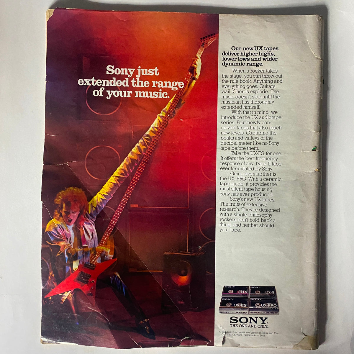 Back cover of Spin Magazine November 1986 featuring an advertisement for Sony UX tapes with a musician playing a red guitar. The ad highlights Sony's audio quality and musical range, complementing the magazine's focus on music legends like Iggy Pop and Elvis Costello.