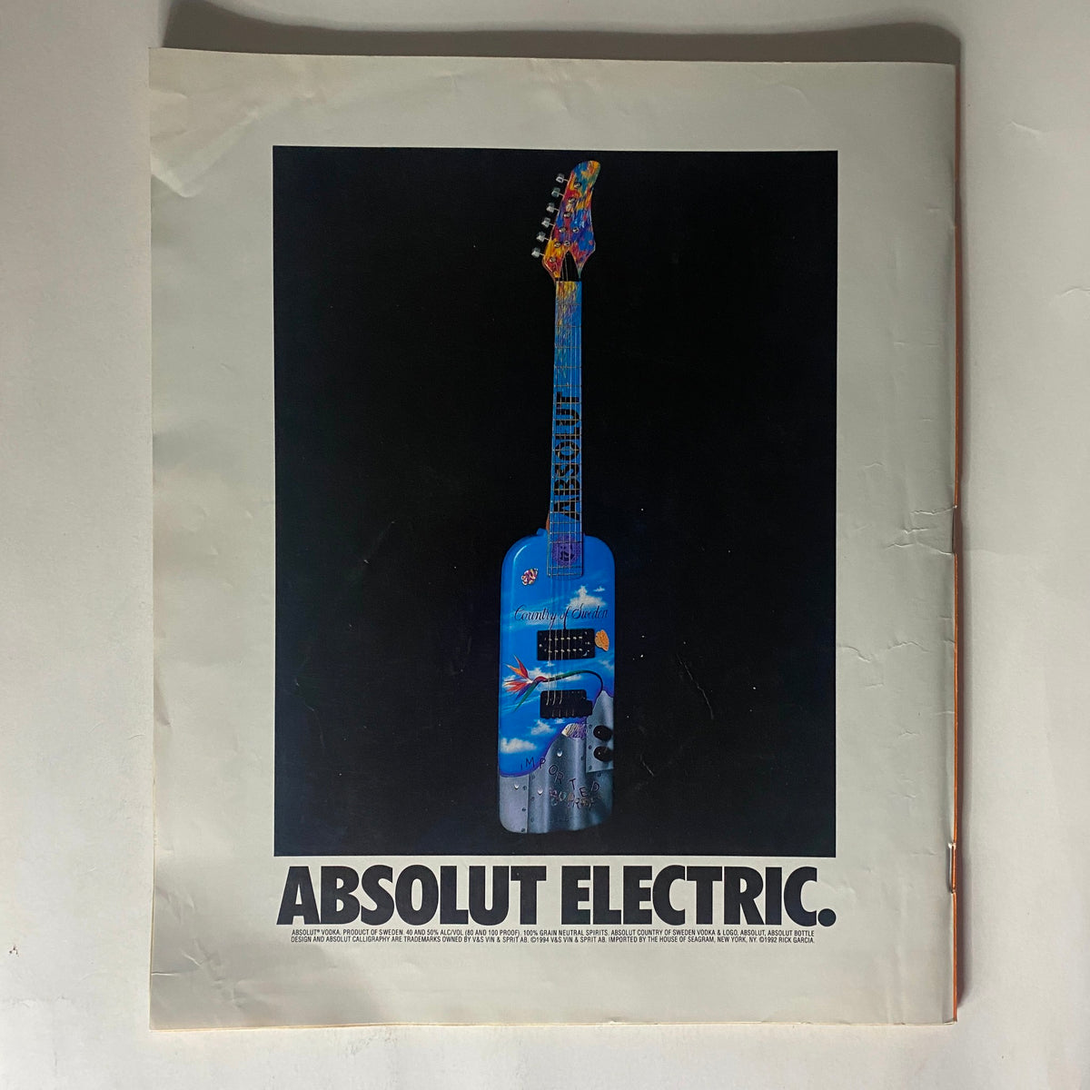 Cover of Spin Magazine February 1996 featuring a vibrant electric guitar graphic and the caption 'ABSOLUT ELECTRIC.' The magazine showcases Trent Reznor on the cover, making it a collectible for fans of 90s alternative rock.