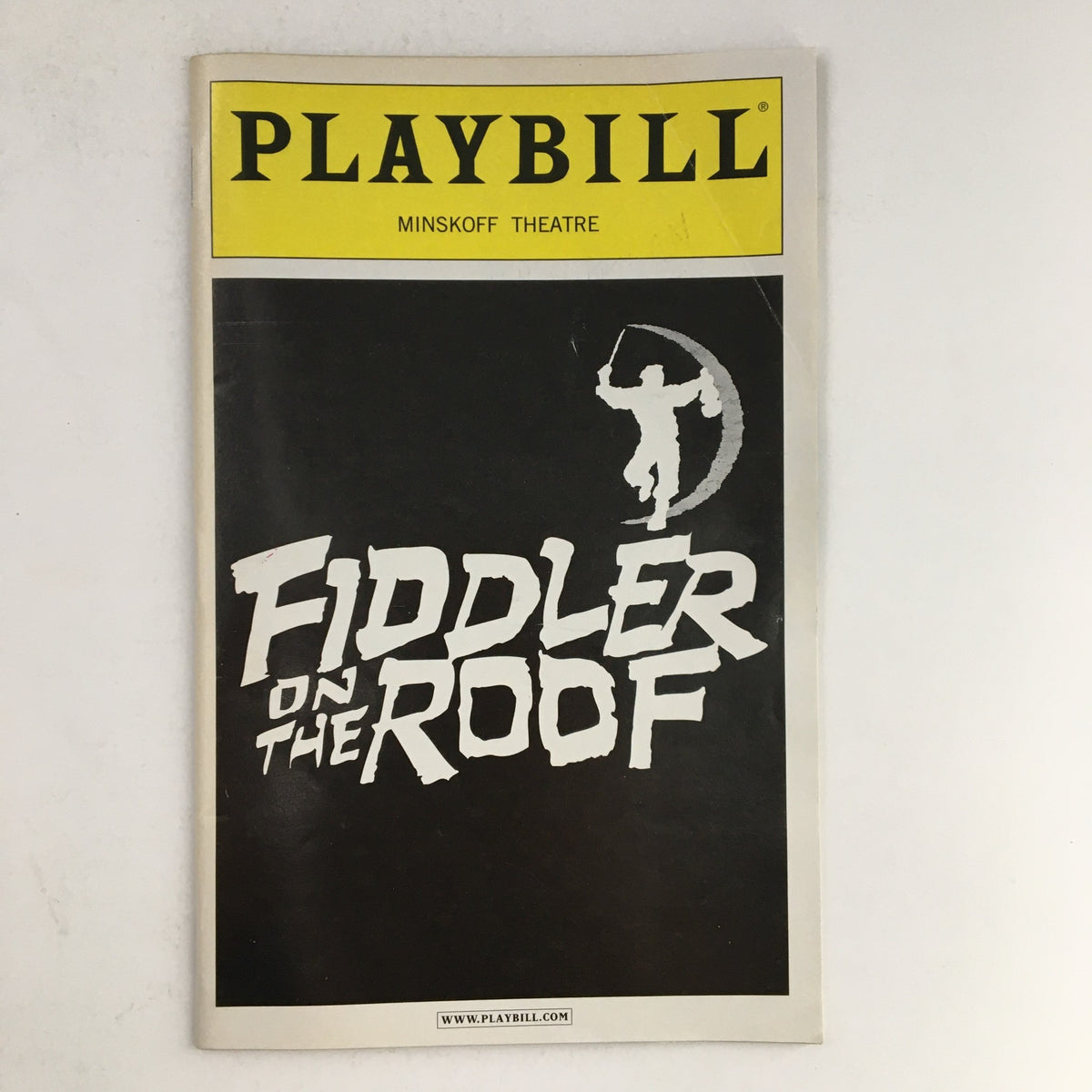 2004 Playbill from Minskoff Theatre featuring Fiddler on the Roof cover design showcasing the title in bold letters.