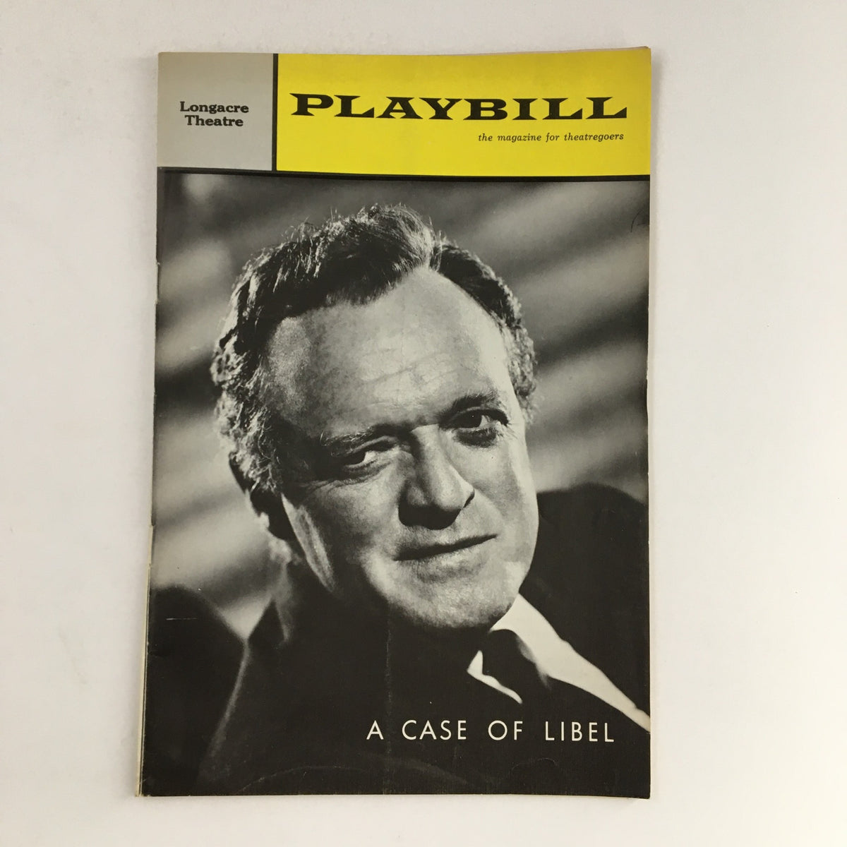Vintage 1963 Playbill for A Case of Libel at Longacre Theatre featuring a prominent actor on the cover.