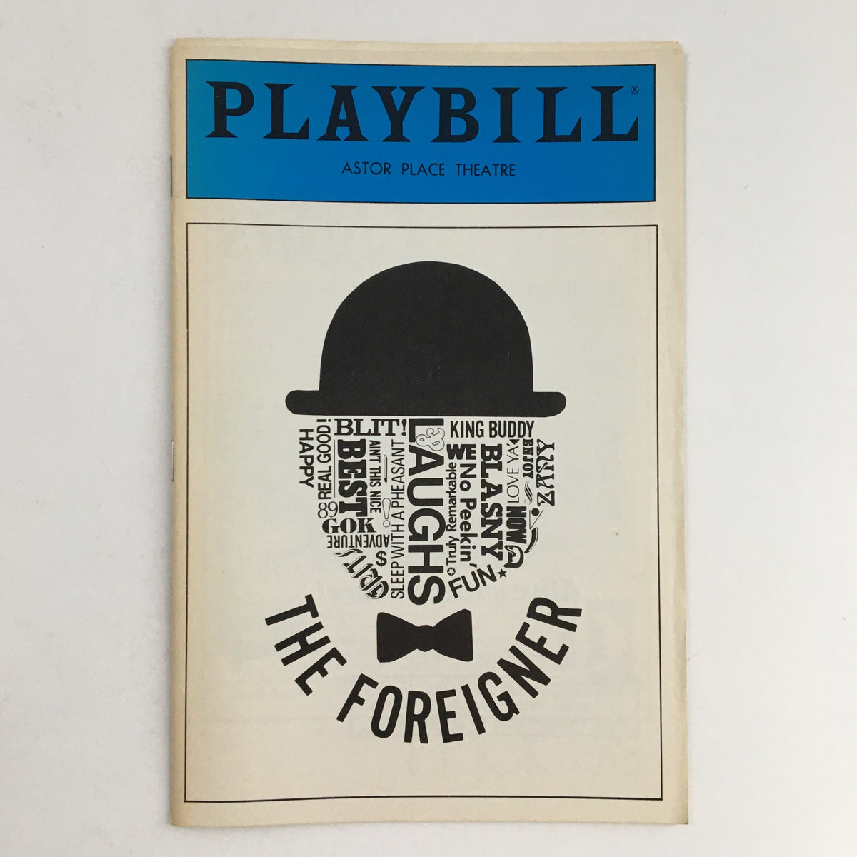 1986 Playbill for The Foreigner at Astor Palace Theatre featuring a unique graphic design with text elements, highlighting its comedic themes.