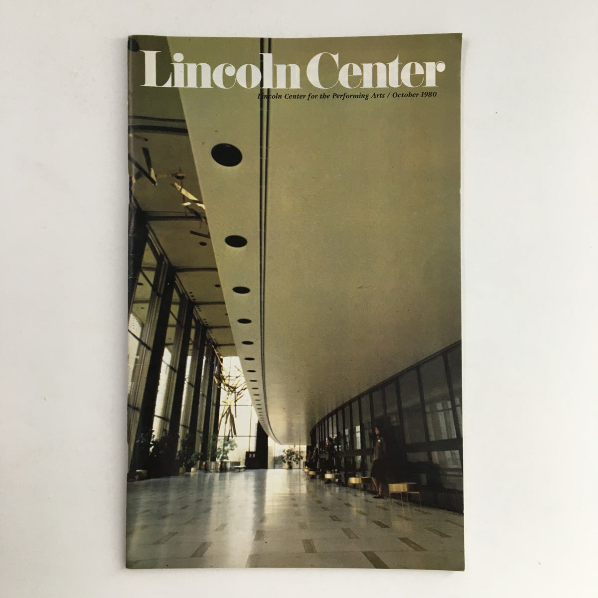 1980 Stagebill Lincoln Center for the Performing Arts Kosty by Henry Kupferberg featuring a spacious interior view of the Lincoln Center with modern architectural elements and seating arrangements.