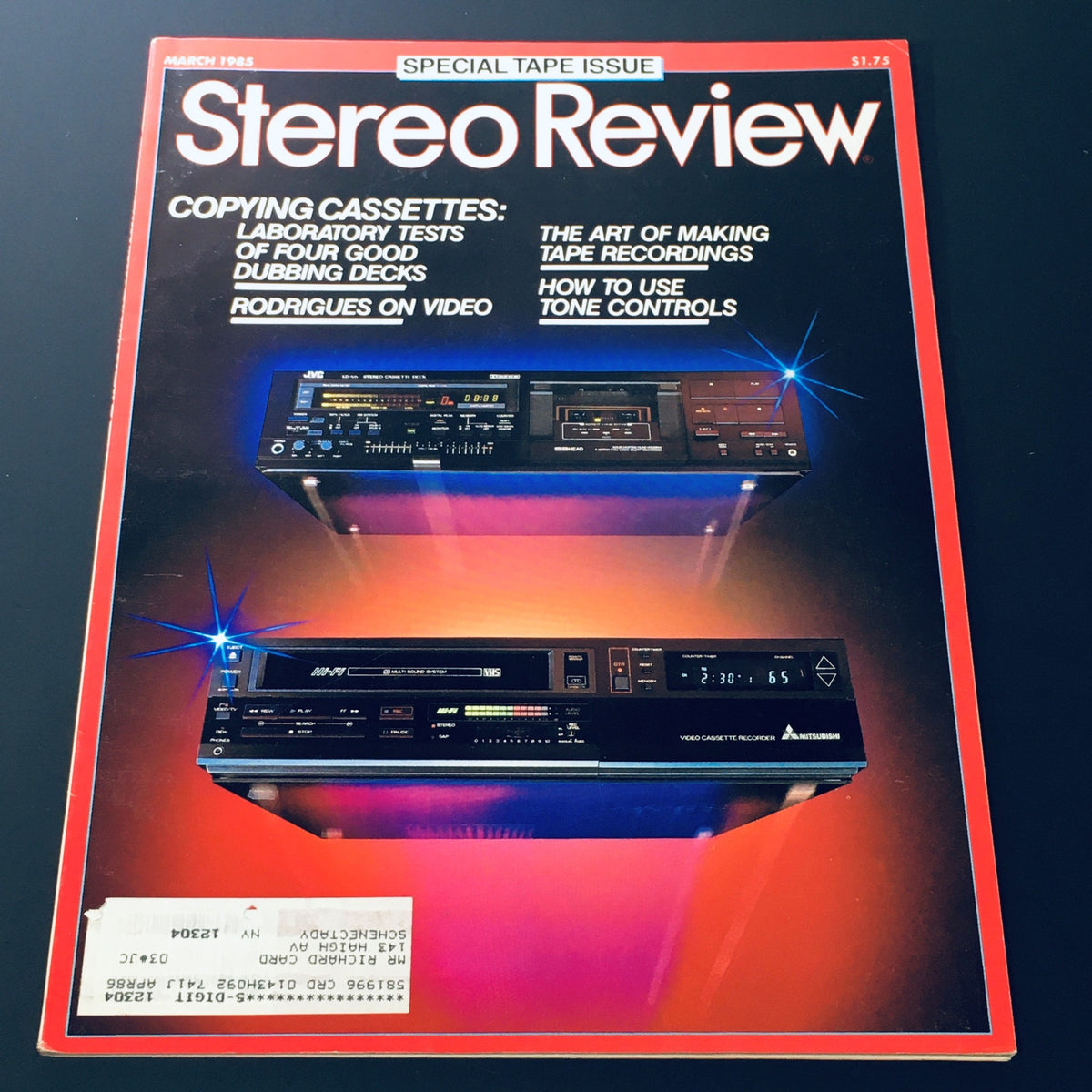 Cover of the Stereo Review Magazine, March 1985, featuring articles on audio technology including 'Rodrigues on Video' and 'How to Use Tone Controls'. The image displays cassette deck designs with vibrant background lighting, emphasizing its focus on audio innovations from the 1980s.