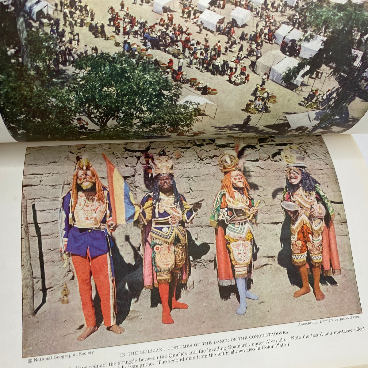 Inside page from the Vintage National Geographic Magazine November 1926 depicting colorful traditional costumes in a cultural dance performance, illustrating the vibrancy of historical Russian culture.