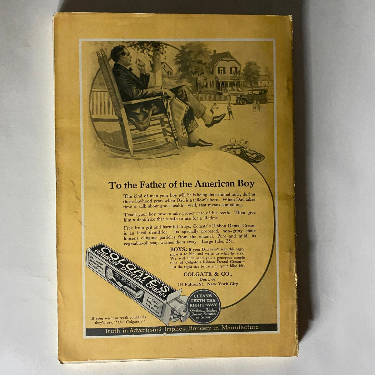 Back cover of the National Geographic Magazine August 1923 featuring an advertisement for Colgate & Co. showcasing a young boy and a serene home setting.