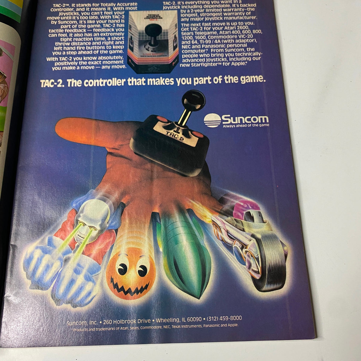 Advertisement for TAC-2 game controller in Electronic Games Magazine September 1984, illustrating the controller's unique design that allows users to physically engage with games.