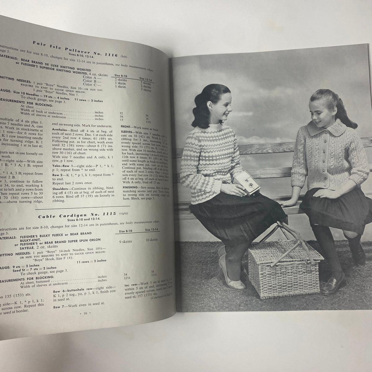 1960 Vol 52 Bulky Knits Boys and Girls Catalog featuring two girls in hand-knit sweaters, sitting together with a picnic basket, showcasing vintage children's fashion.