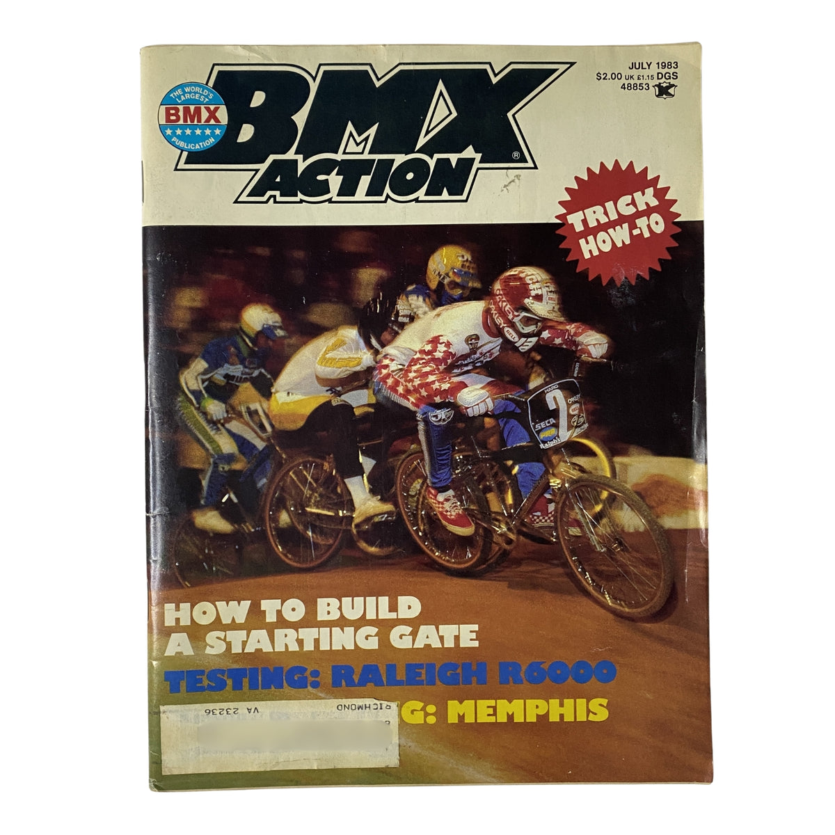 BMX Action Magazine July 1983 Vol 8 No. 7 cover featuring Toby Henderson racing in Memphis with details about how to build a starting gate and testing the Raleigh R6000.