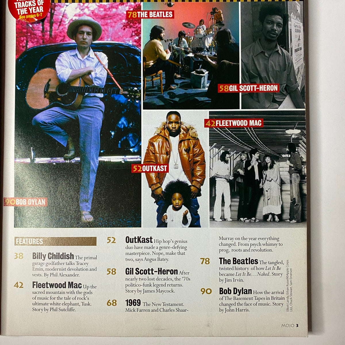 Inside page of Mojo Music Magazine December 2003 showcasing features on Billy Childish, Fleetwood Mac, OutKast, and Bob Dylan, alongside artwork related to the magazine's music themes.