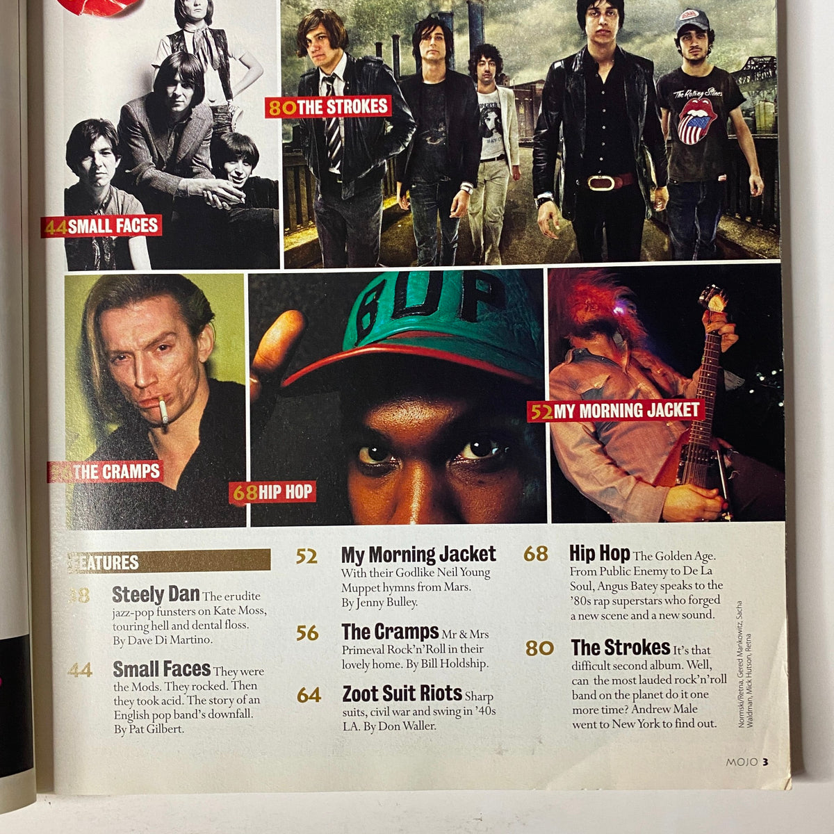 Inside spread of Mojo Music Magazine September 2003 showcasing features on Small Faces, The Cramps, and other artists, including album details and page numbers.