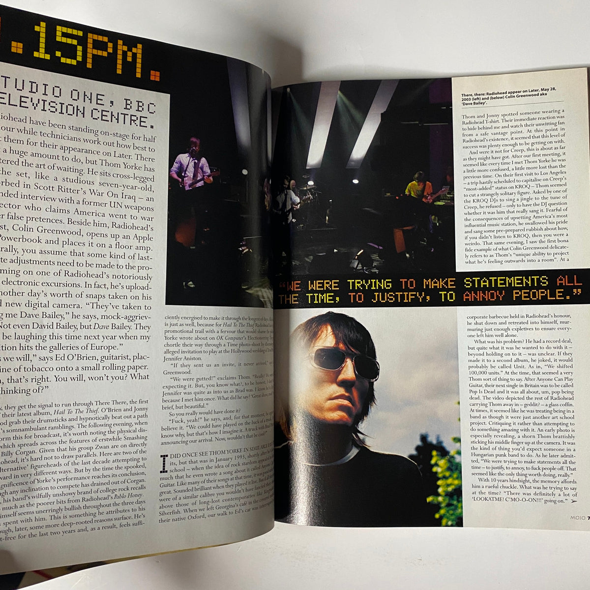 Inside Mojo Music Magazine August 2003 featuring an in-depth interview with Radiohead, alongside images of their performance.