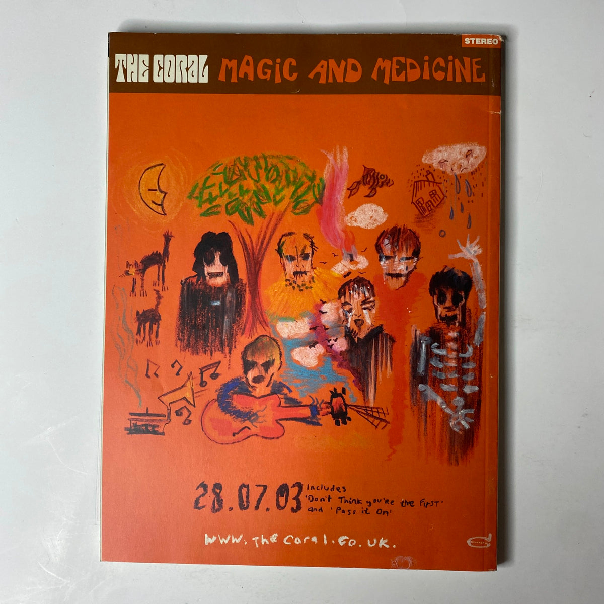 Cover of Mojo Music Magazine August 2003 featuring Radiohead, depicted in vibrant colors with abstract art, capturing the band's pivotal moment post their album release and Glastonbury performance. The magazine is in good condition and includes notable articles on modern rock and iconic artists.