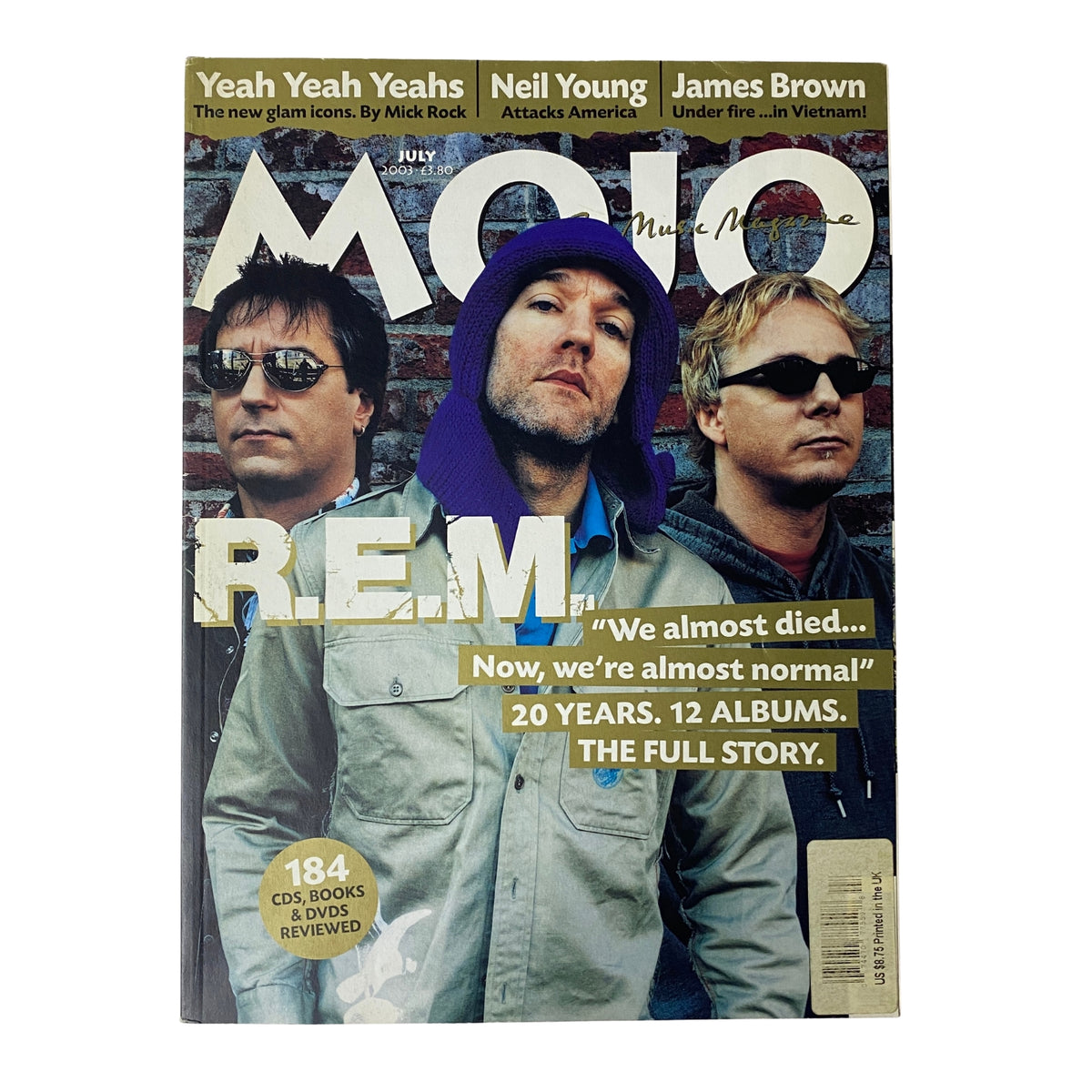 Mojo Music Magazine July 2003 featuring R.E.M. on the cover, showcasing the band's 20 years of influence in alternative rock. The magazine highlights interviews and reflections from members Michael Stipe, Peter Buck, and Mike Mills.