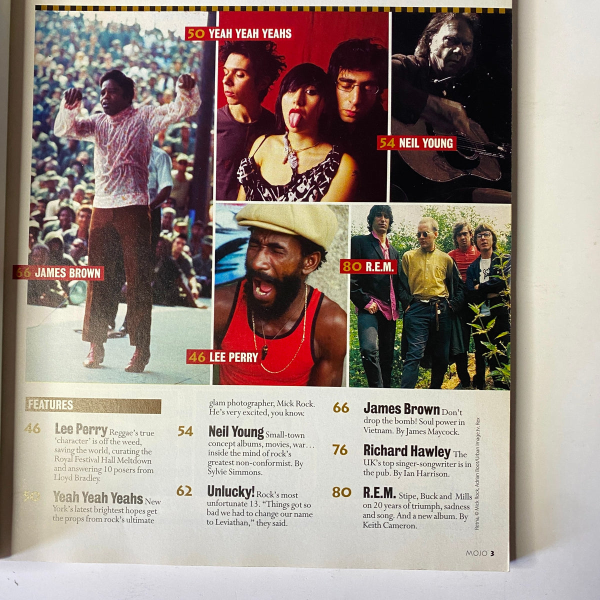 Inside page of Mojo Music Magazine July 2003 analyzing various features including Yeah Yeah Yeahs, Neil Young, James Brown, and Lee Perry, with images of the artists and thematic discussions.